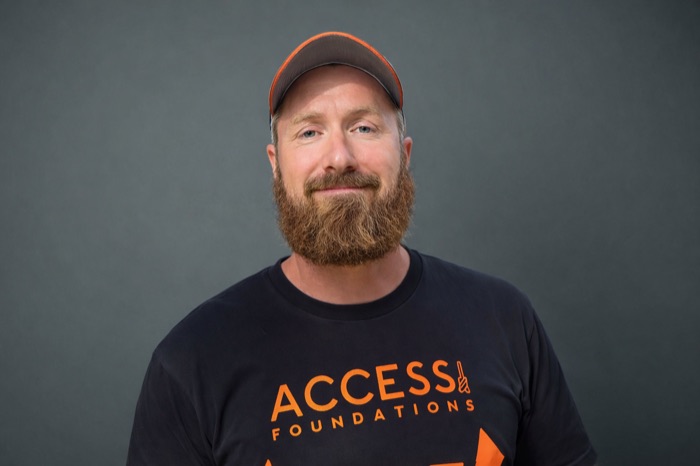 Aidan Teague, founder of BasementCheck, in an Access Foundations shirt