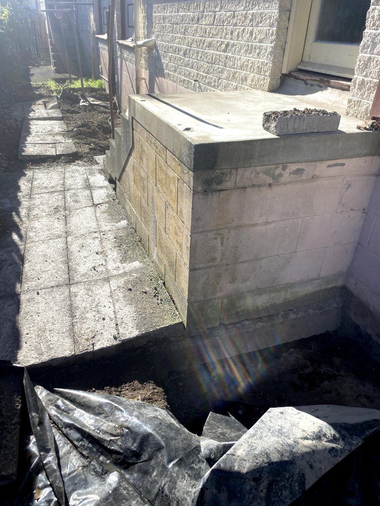 Exposed footing beneath the landing